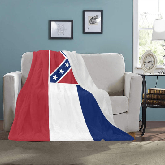 Soft blanket with [Luv My Flag] design on white sofa.