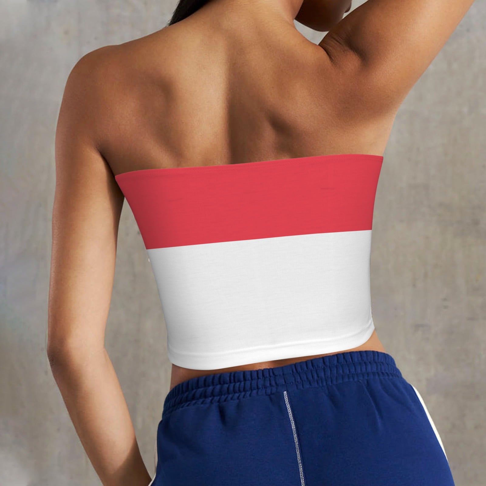 Back view of person wearing [Brand] red and white top.
