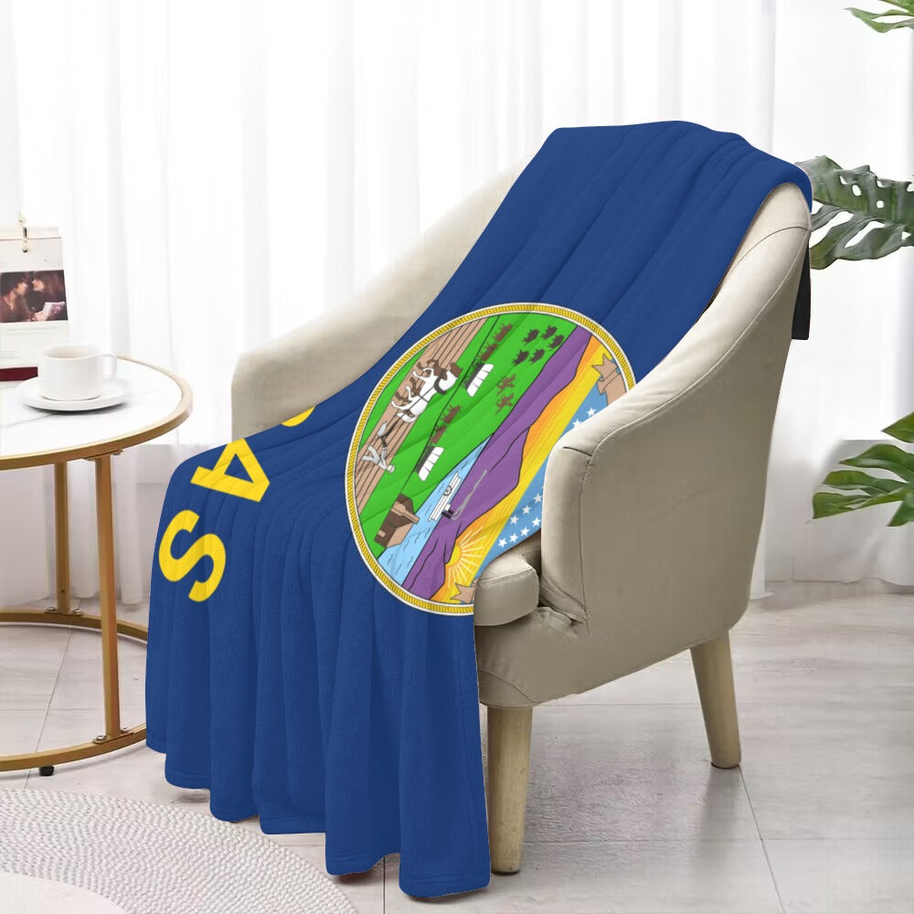 Blue throw blanket with Kansas design on white chair. Luv My Flag.