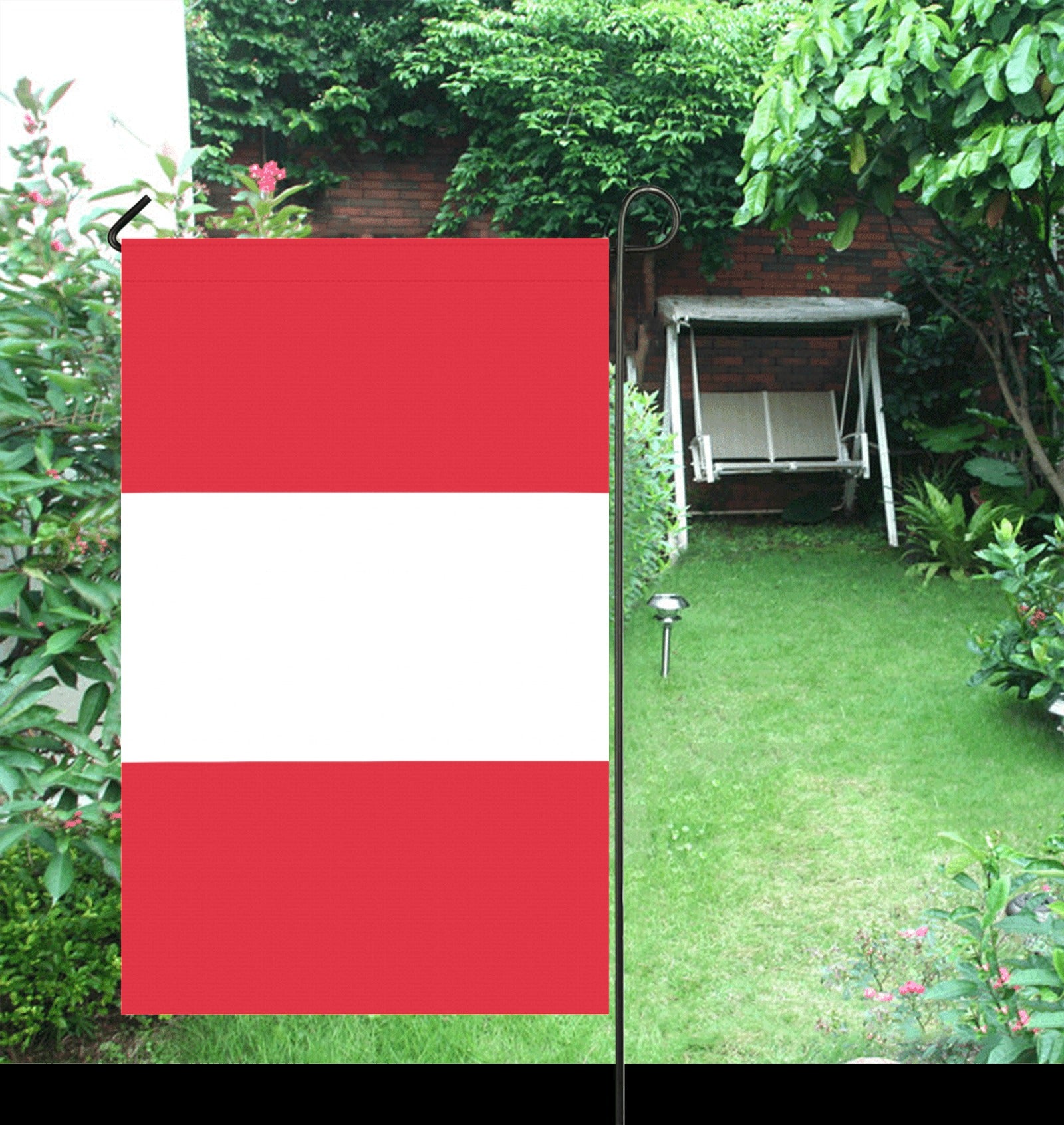 Luv My Flag red and white flag in garden.