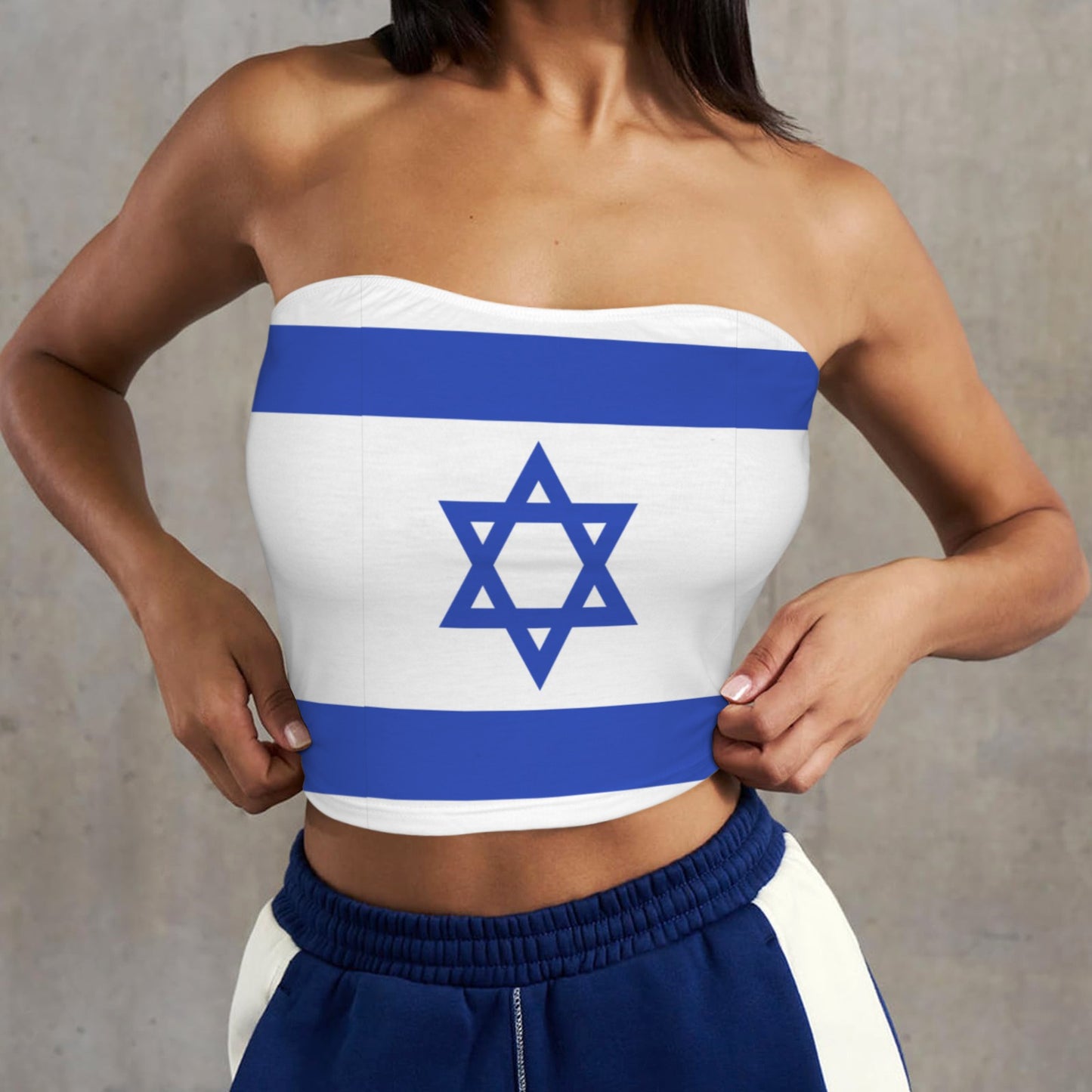 Woman wearing [Brand] top featuring Israeli flag design.