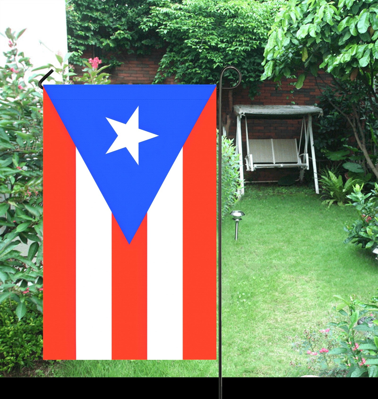 Puerto Rico flag garden flag in backyard.