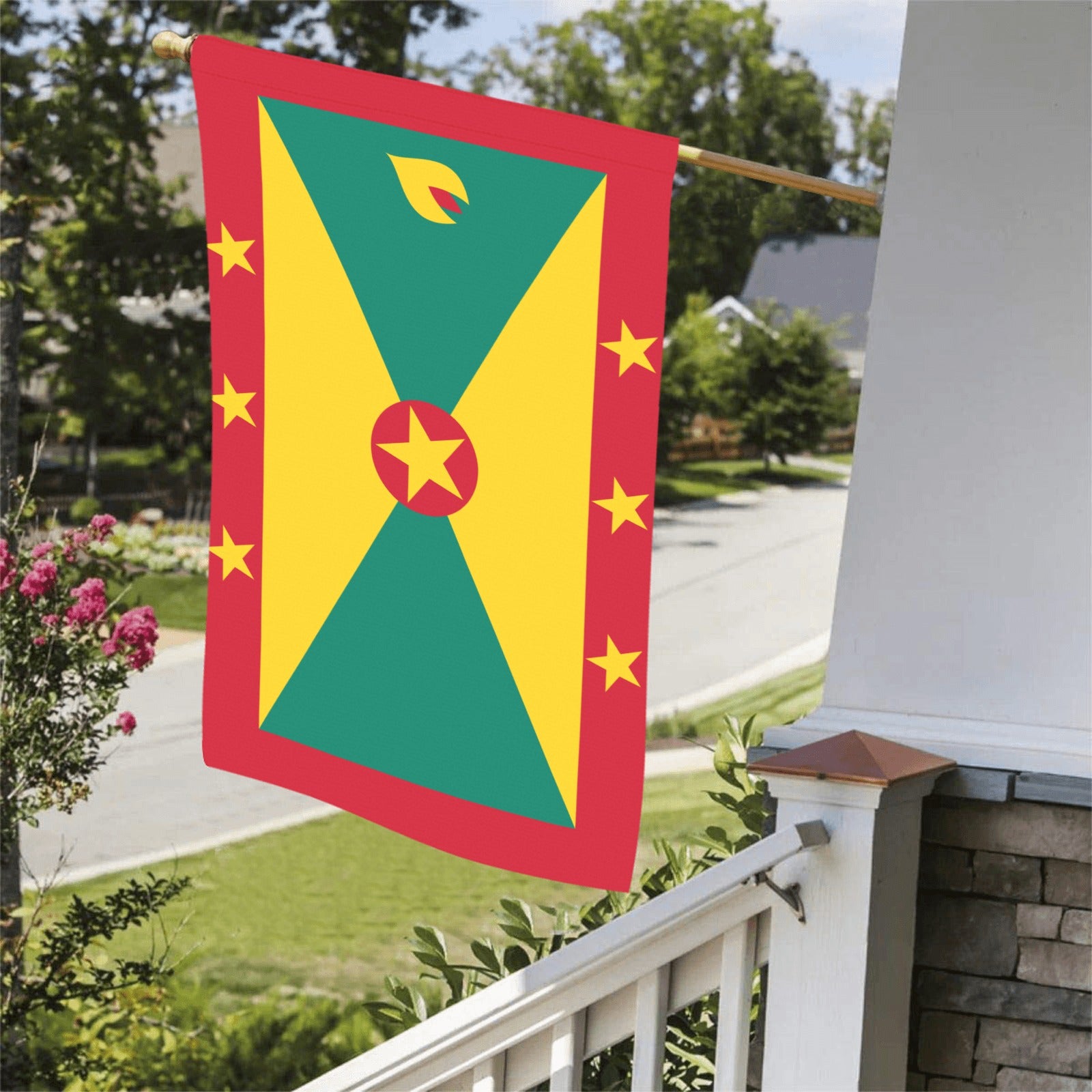 House displaying a vibrant Grenada flag by Luv My Flag.