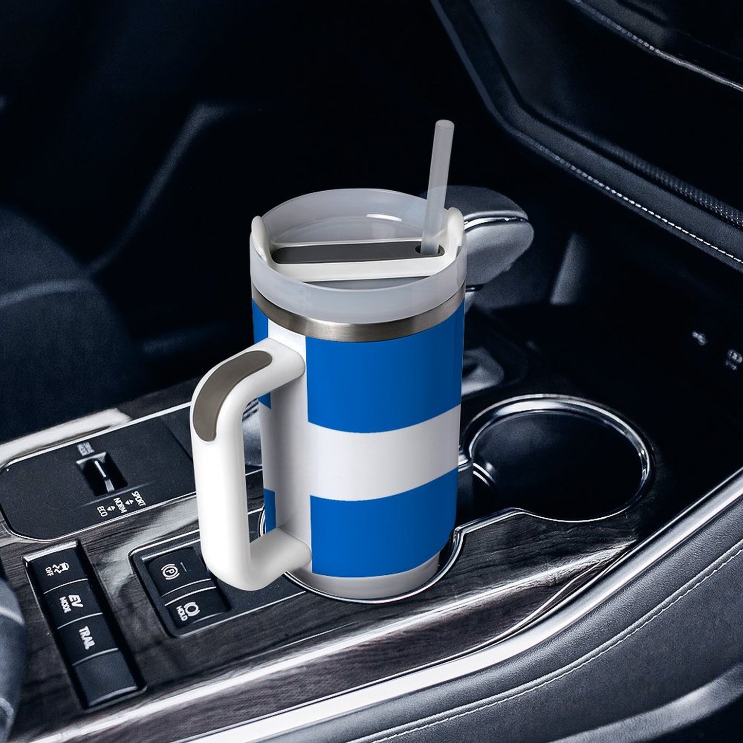 [Brand] blue striped mug with straw in car cupholder.