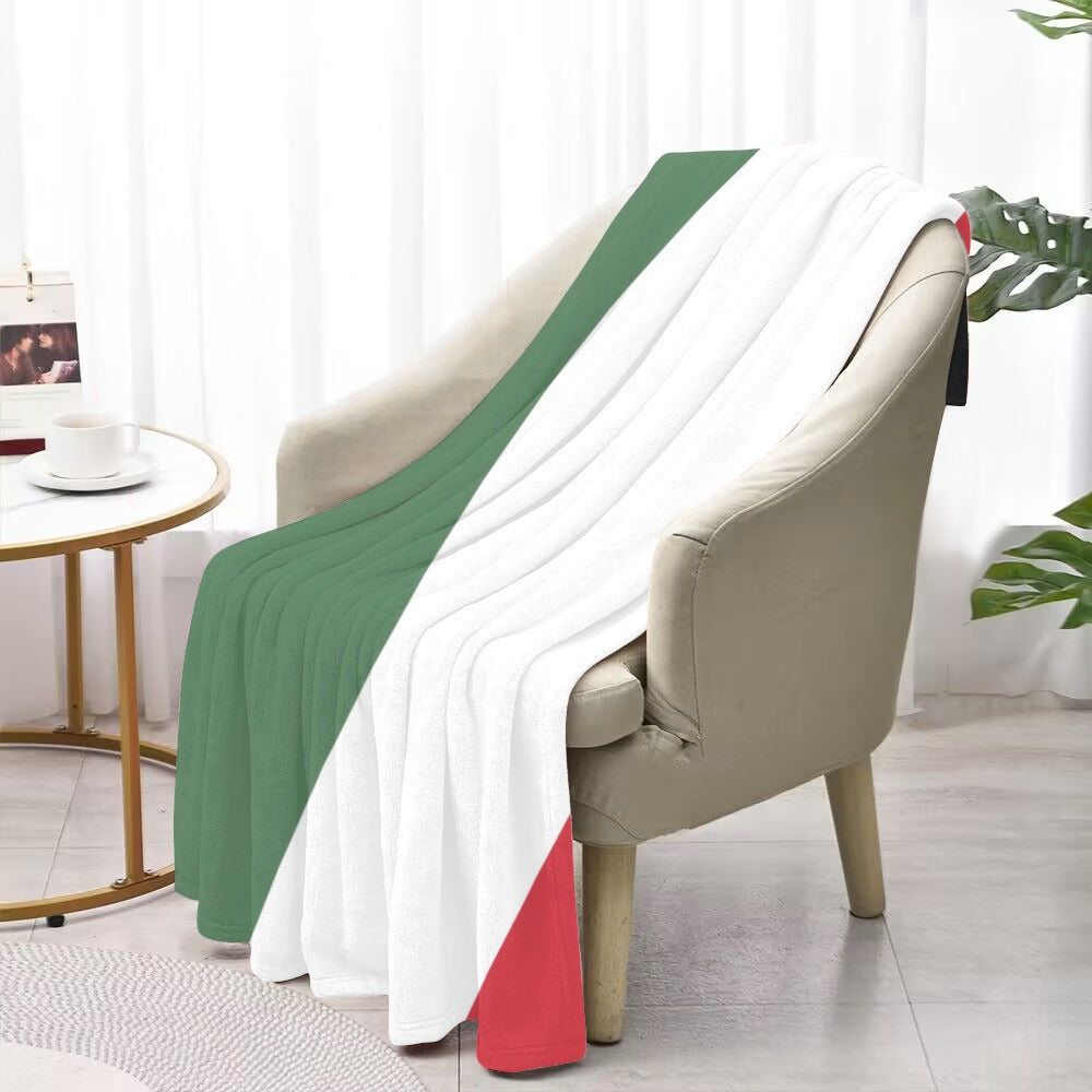 Cozy chair with Luv My Flag tricolor blanket draped.