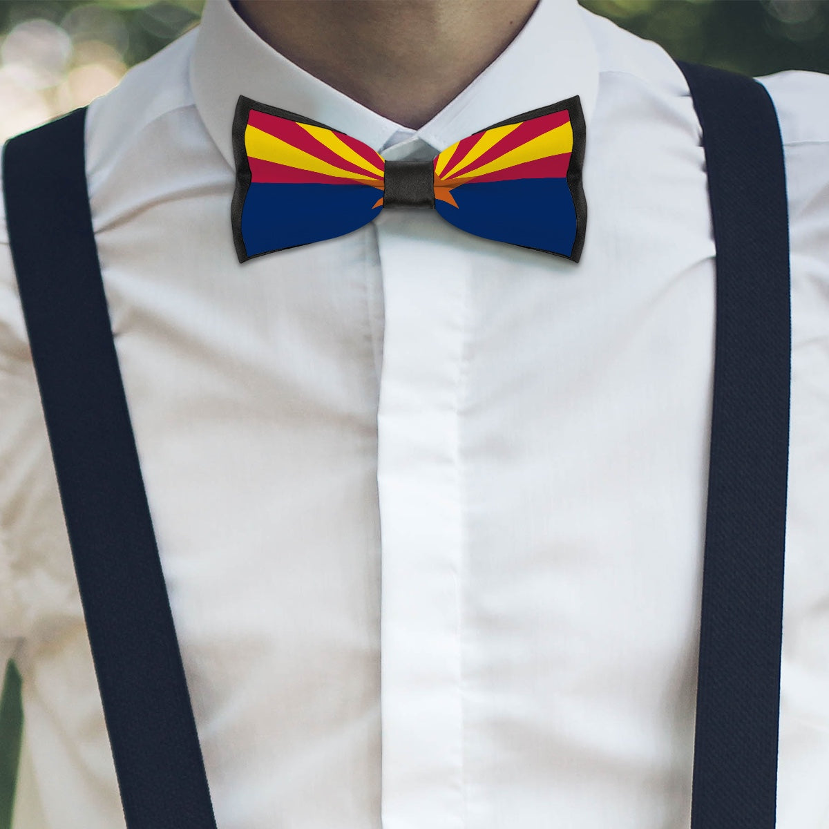 Young man wearing [Brand] Arizona flag bow tie, suspenders.