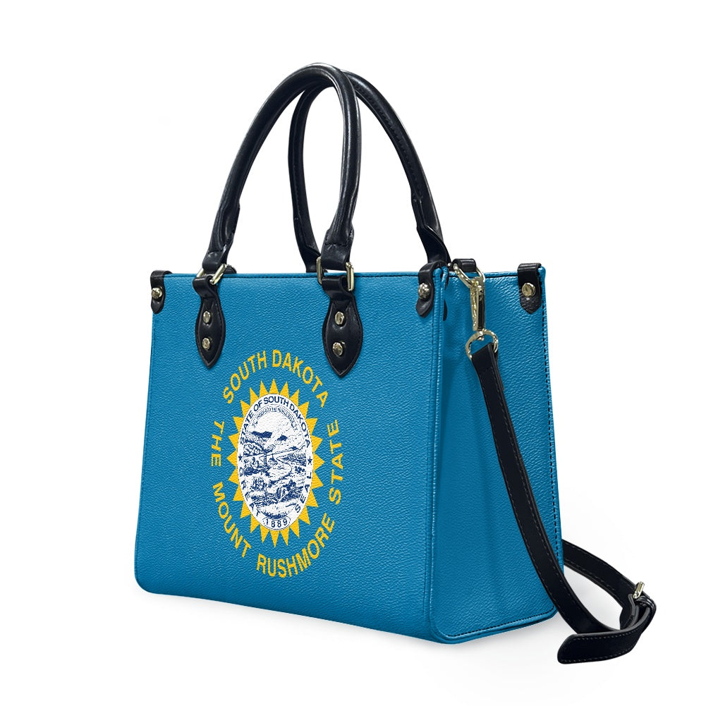 Blue [Brand] handbag with South Dakota seal design, stylish.