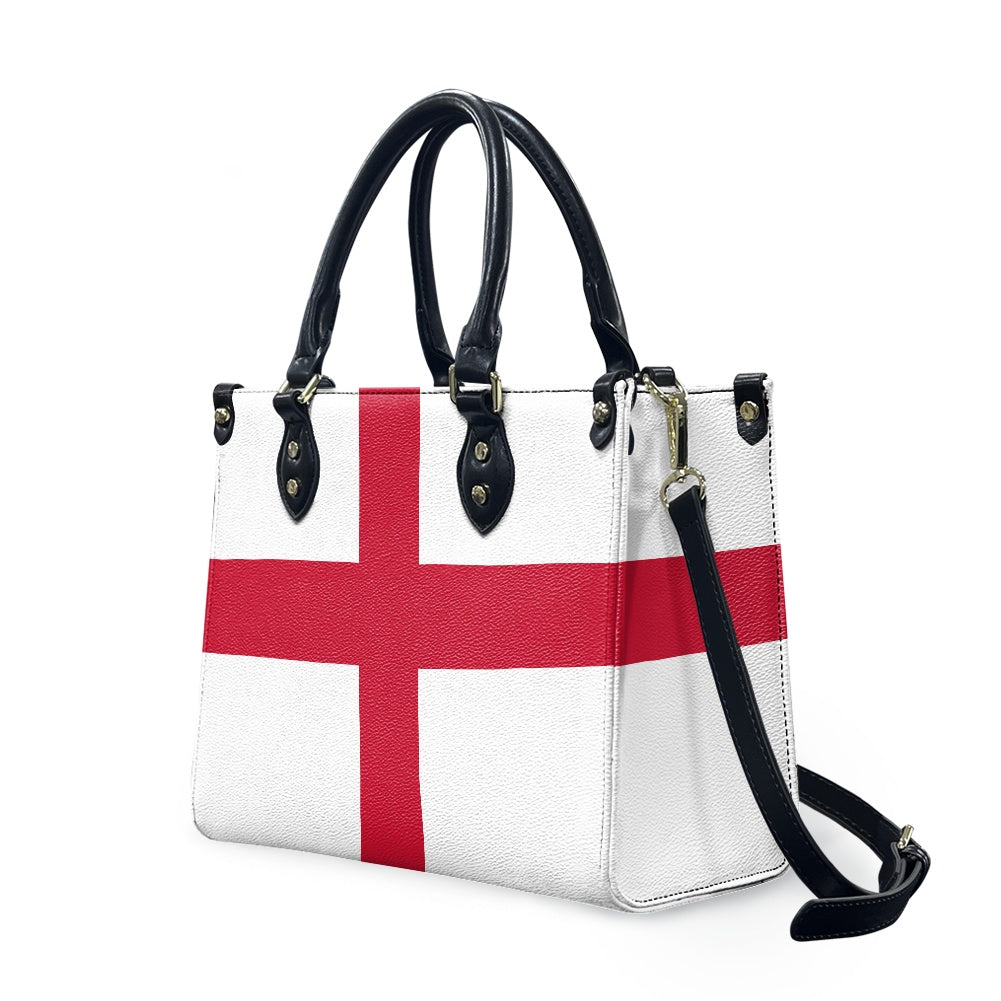 [Brand] handbag featuring England flag design with black handles.