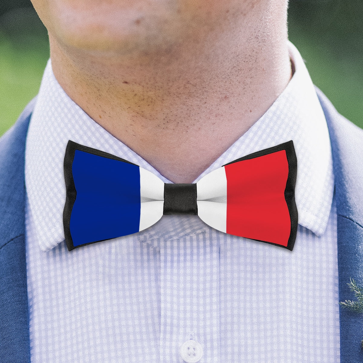 [Brand] bow tie with French flag design on shirt.