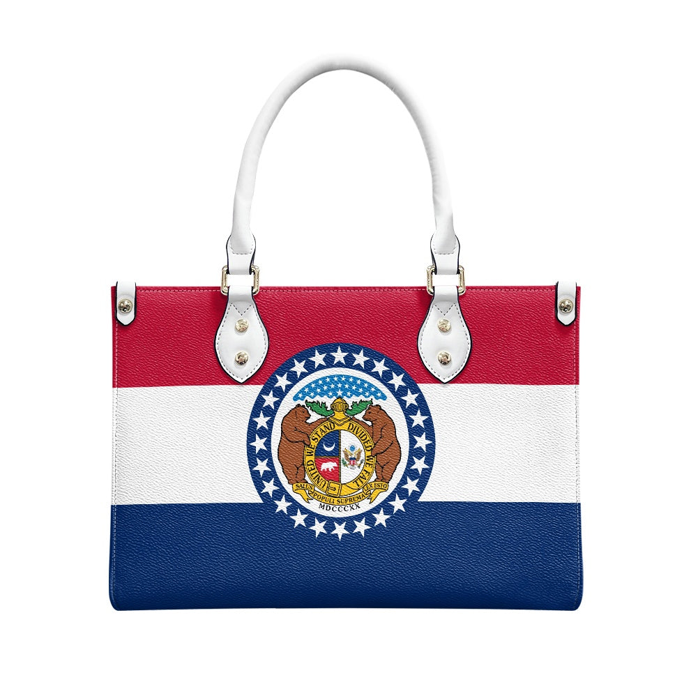 [Brand] handbag featuring Missouri flag design, elegant white handles.
