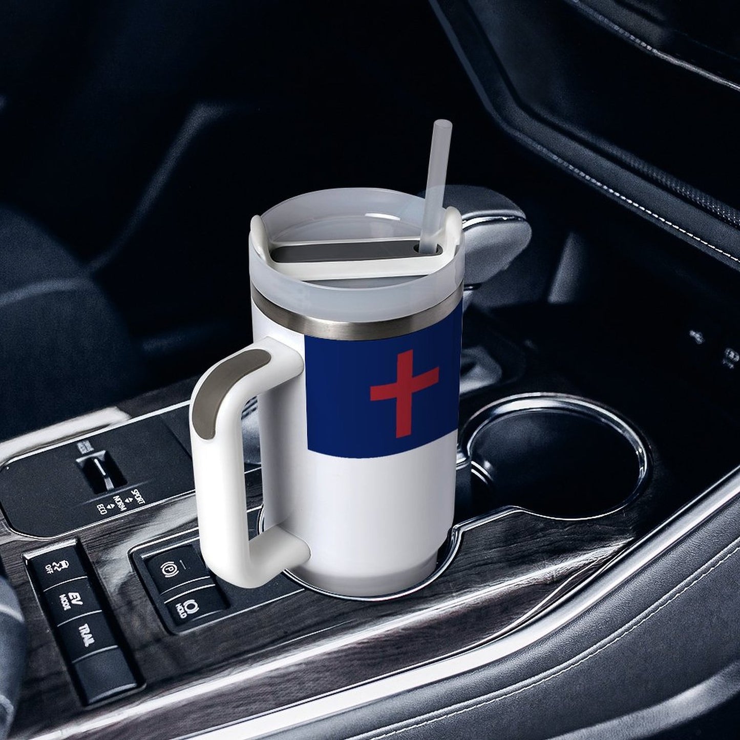 [Brand] mug with straw in a car cup holder.