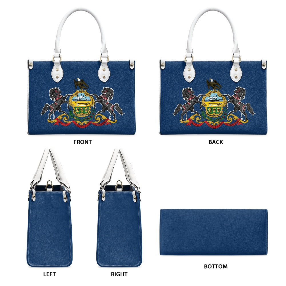 [Brand] blue handbag with embroidered design, white handles.