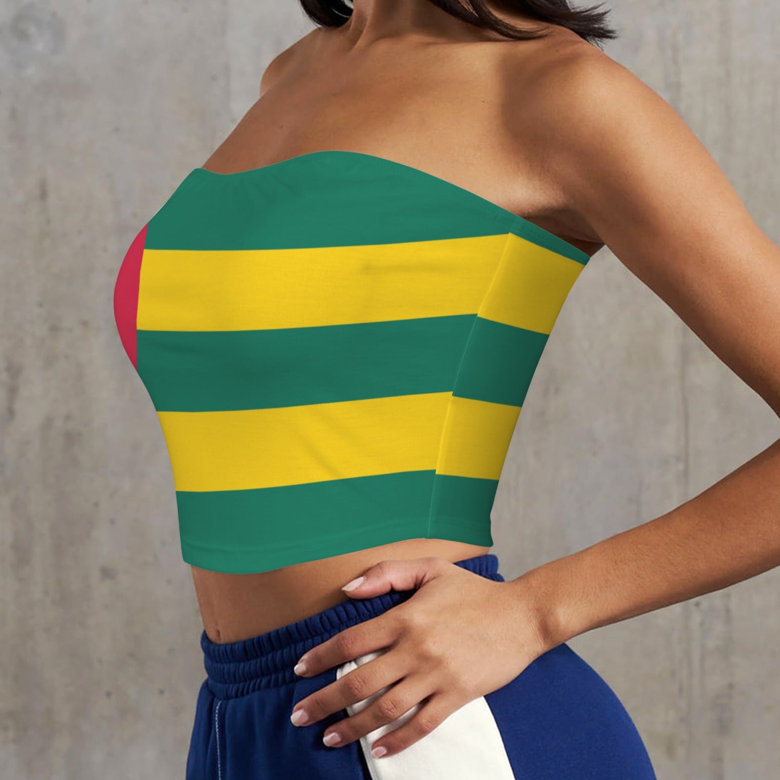 Woman wearing [Brand] strapless green and yellow striped top.