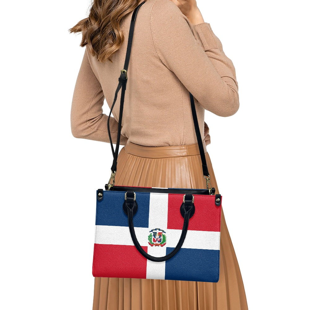 Woman carrying [Brand] Dominican Republic flag patterned handbag.