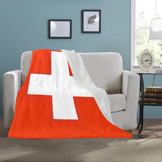 Cozy Luv My Flag Swiss blanket draped over sofa.