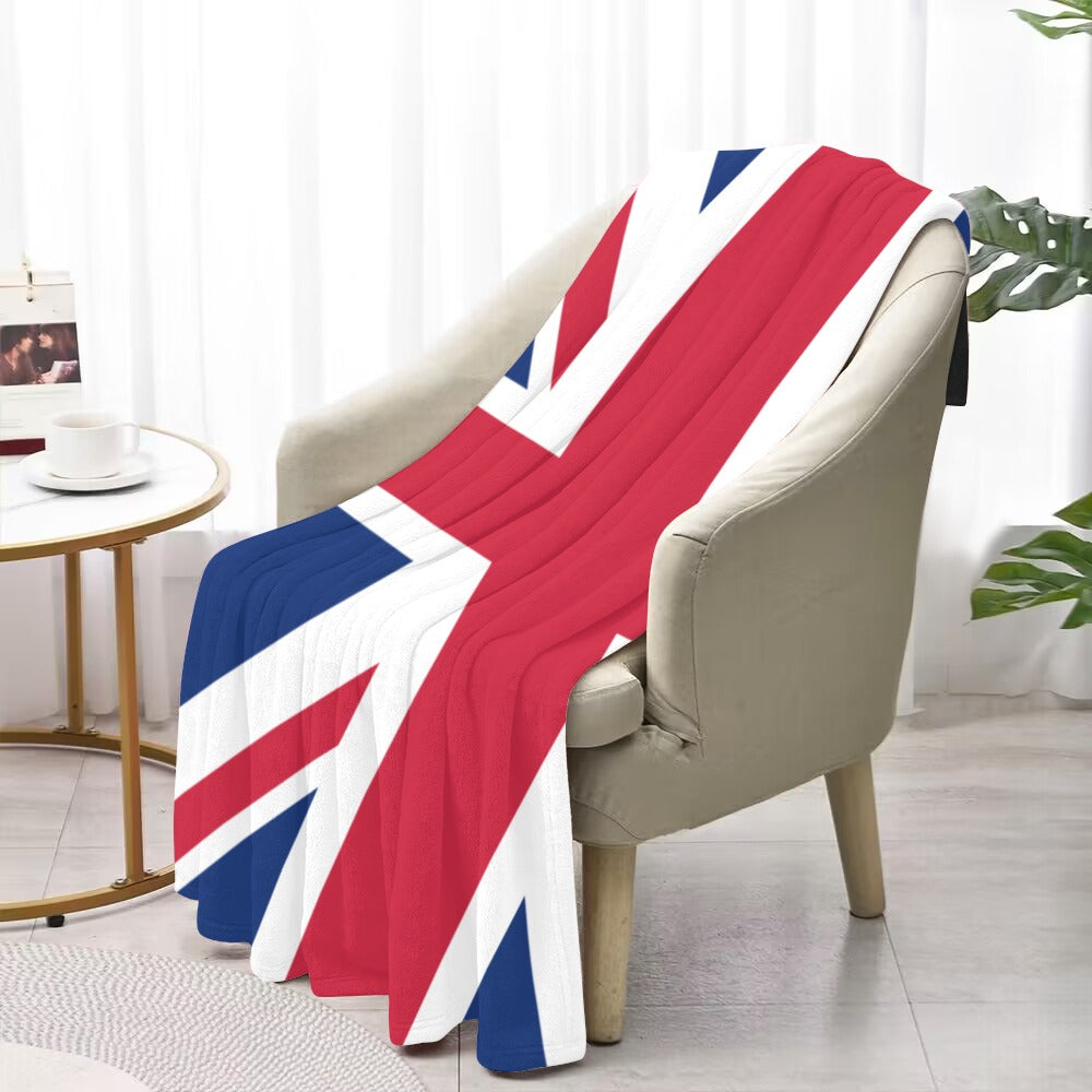 Luv My Flag blanket with Union Jack draped over chair.
