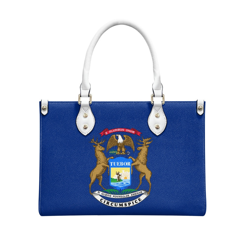 Blue handbag with Michigan state seal, white handles, [Brand].