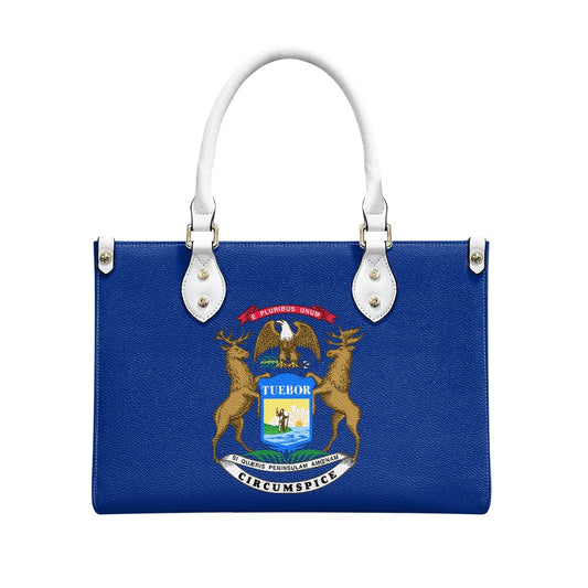 Blue handbag with Michigan state seal, white handles, [Brand].