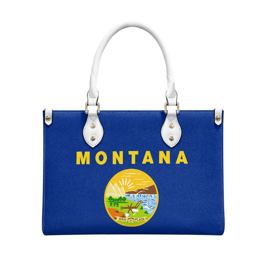 [Brand] blue handbag with Montana design and white handles.