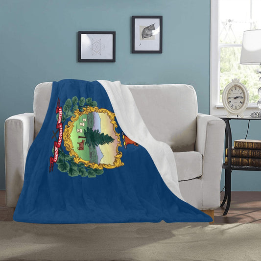 [Luv My Flag] Vermont-themed blanket draped over white sofa.