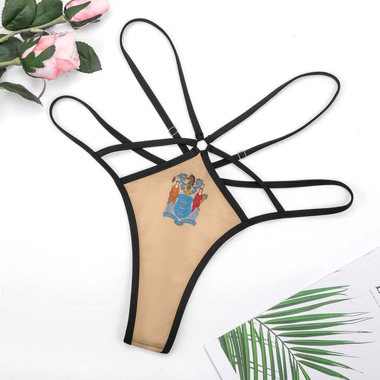 [Brand] intricate beige thong with black straps, floral decoration.
