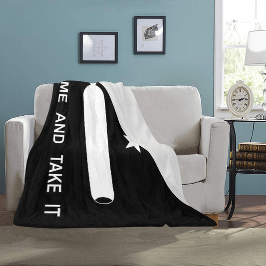 Cozy Luv My Flag blanket on sofa, black and white.