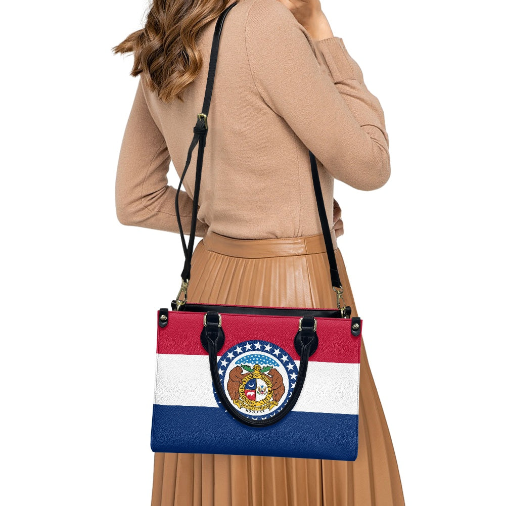 Woman carrying [Brand] bag with Missouri flag design.