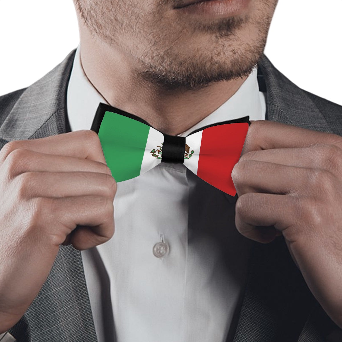 Man adjusting [Brand] Mexican flag-themed bow tie on shirt.