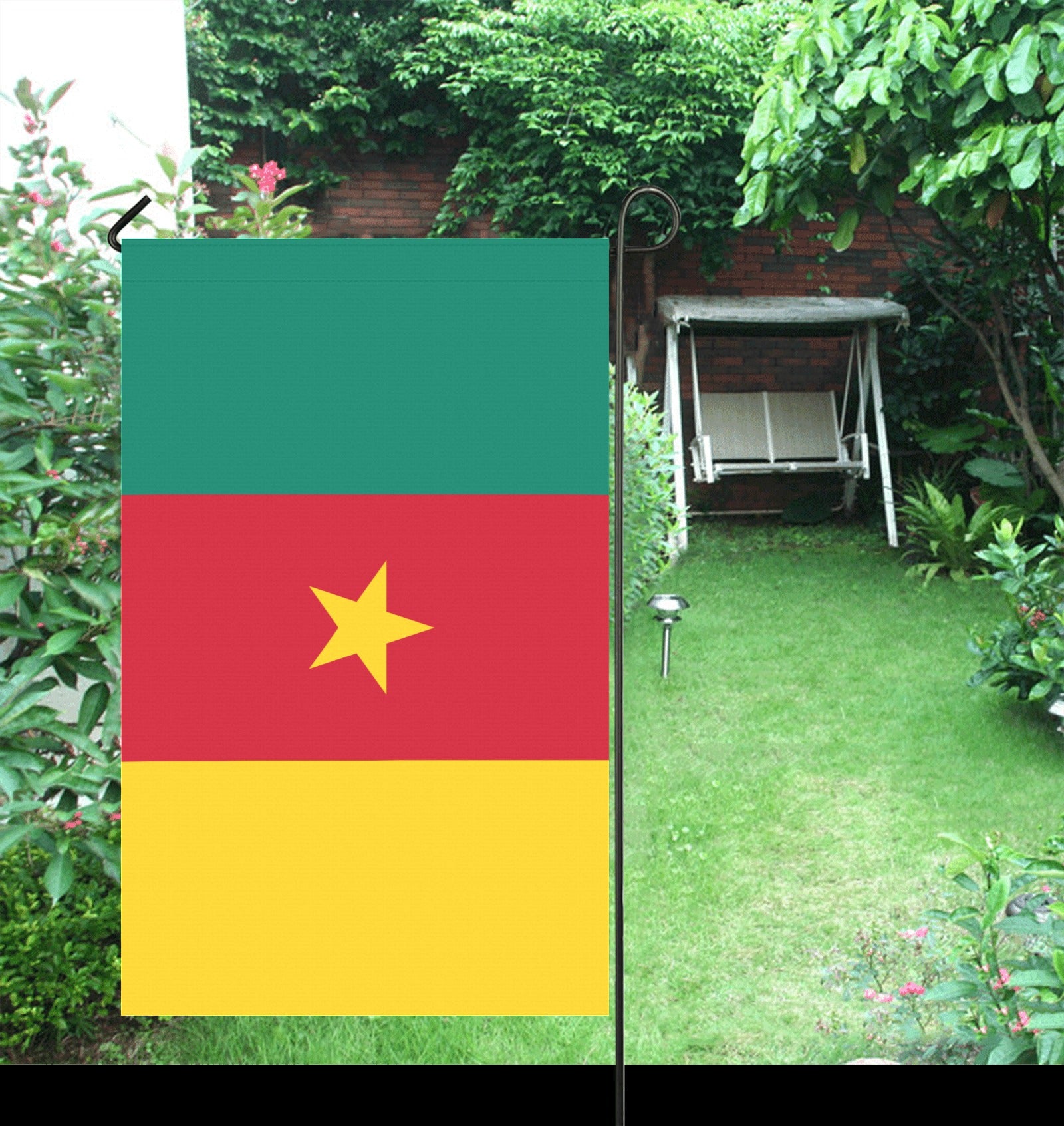 Luv My Flag garden flag in a lush green backyard.