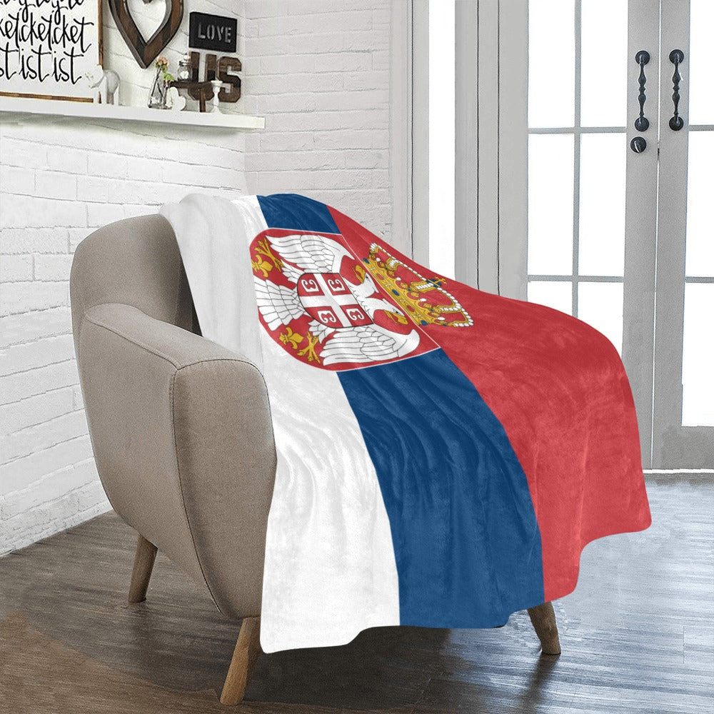 Cozy chair draped with Luv My Flag Serbia blanket.