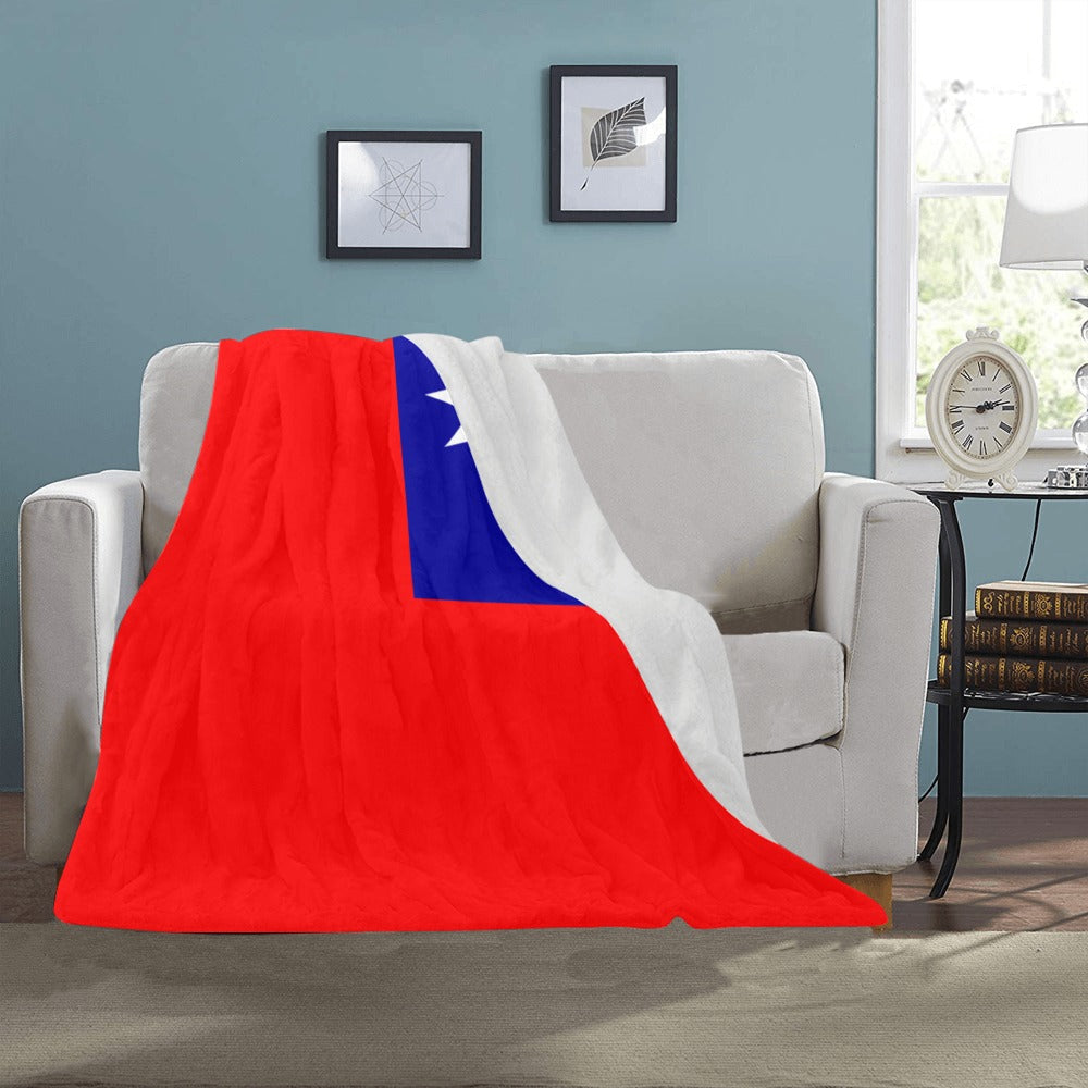 Sofa with Luv My Flag blanket featuring bold, colorful design.