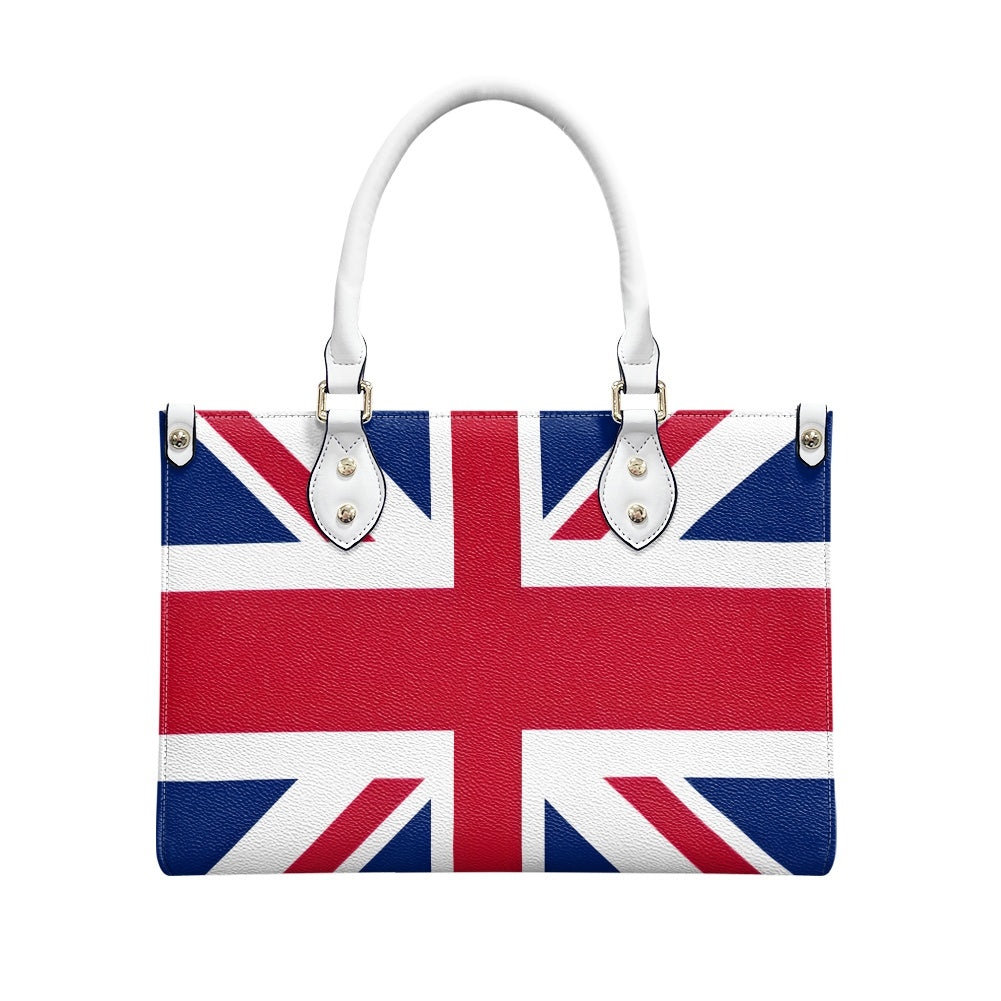 [Brand] handbag featuring Union Jack flag design and white handles.
