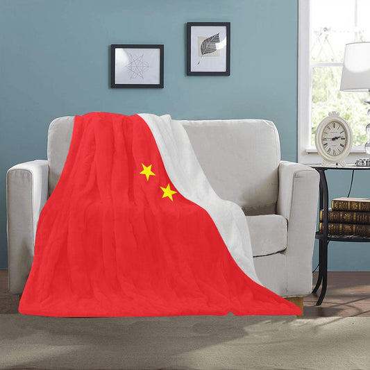 Cozy sofa with Luv My Flag red, yellow blanket.
