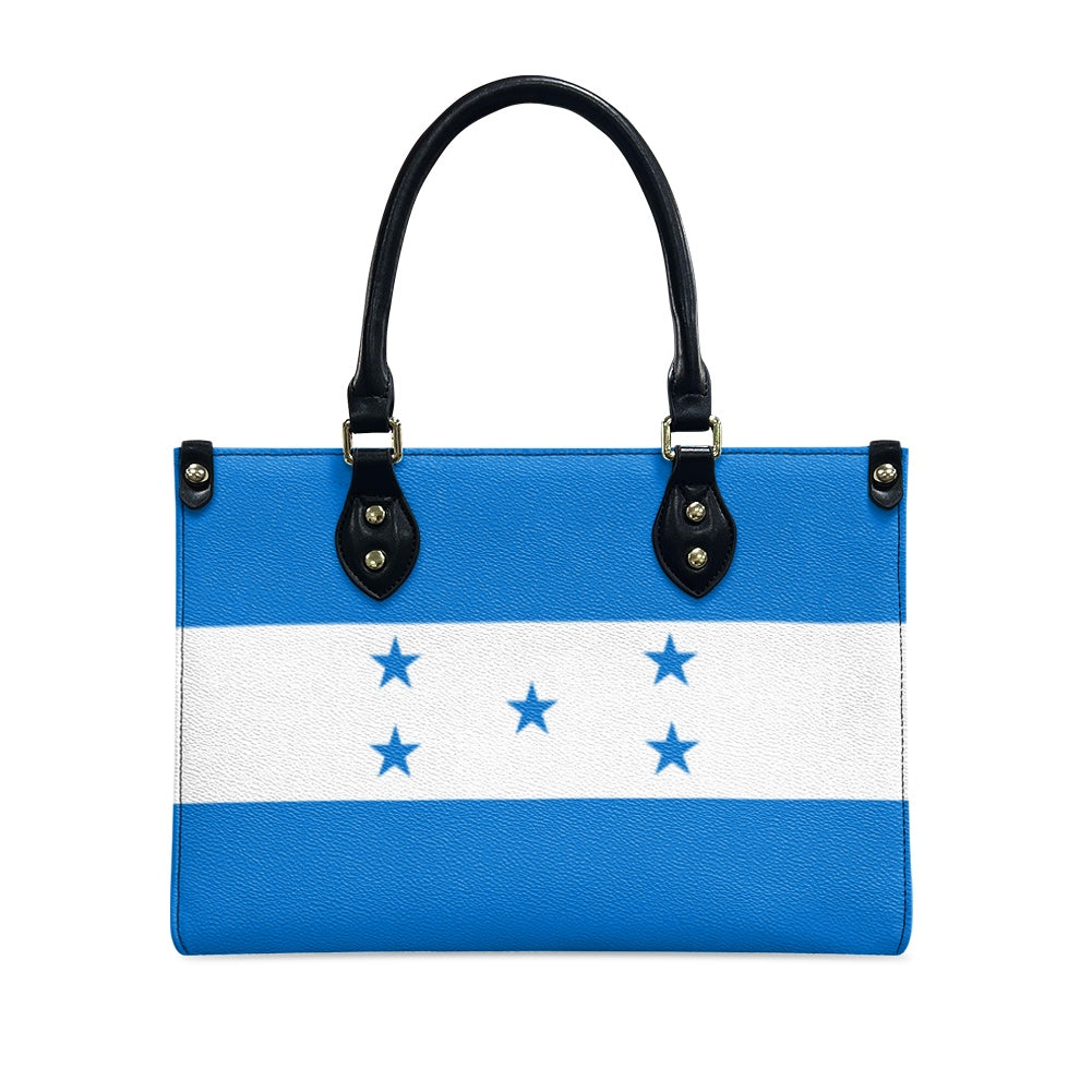 [Brand] handbag with Honduran flag design and black handles.