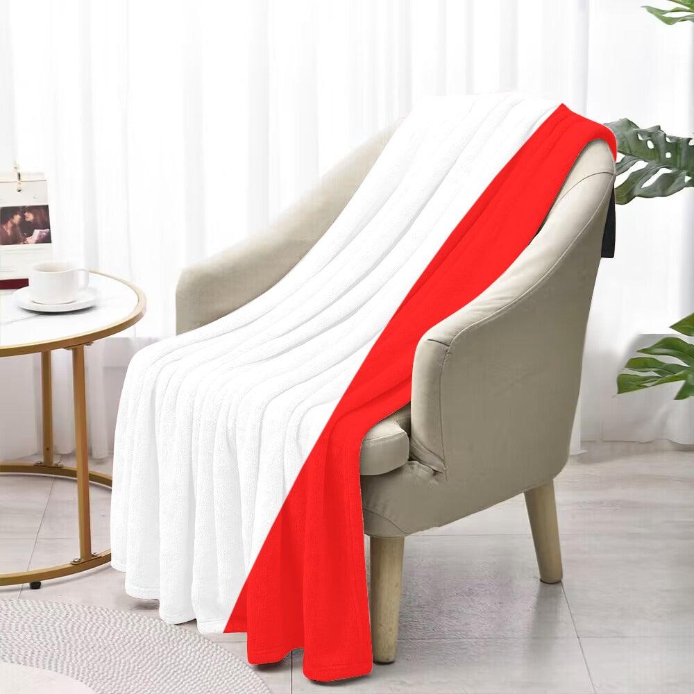 Luv My Flag blanket on chair, white and red.