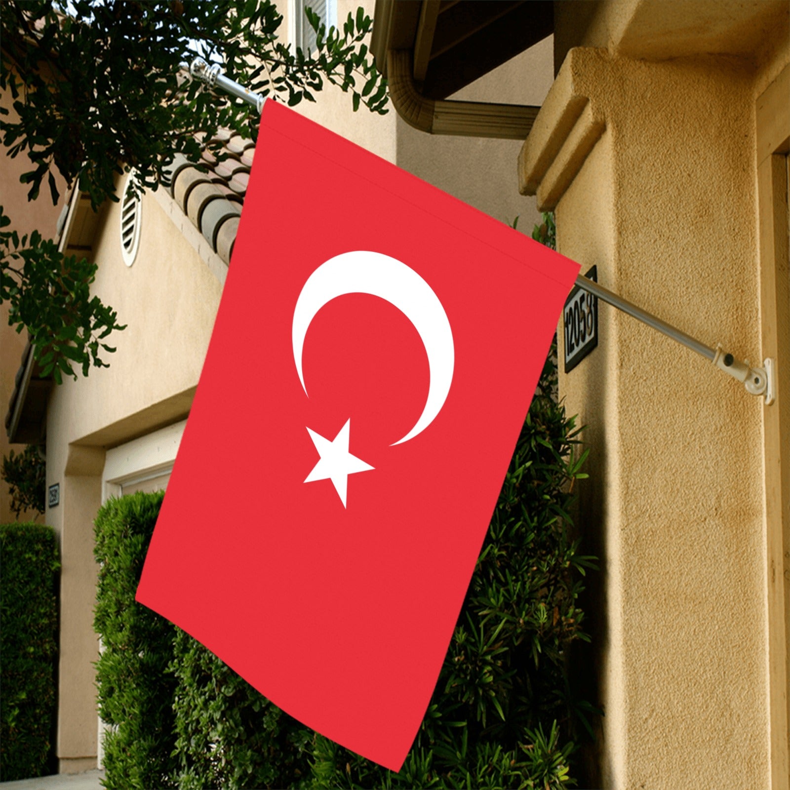 Red flag with crescent, star hung outside house. Luv My Flag.