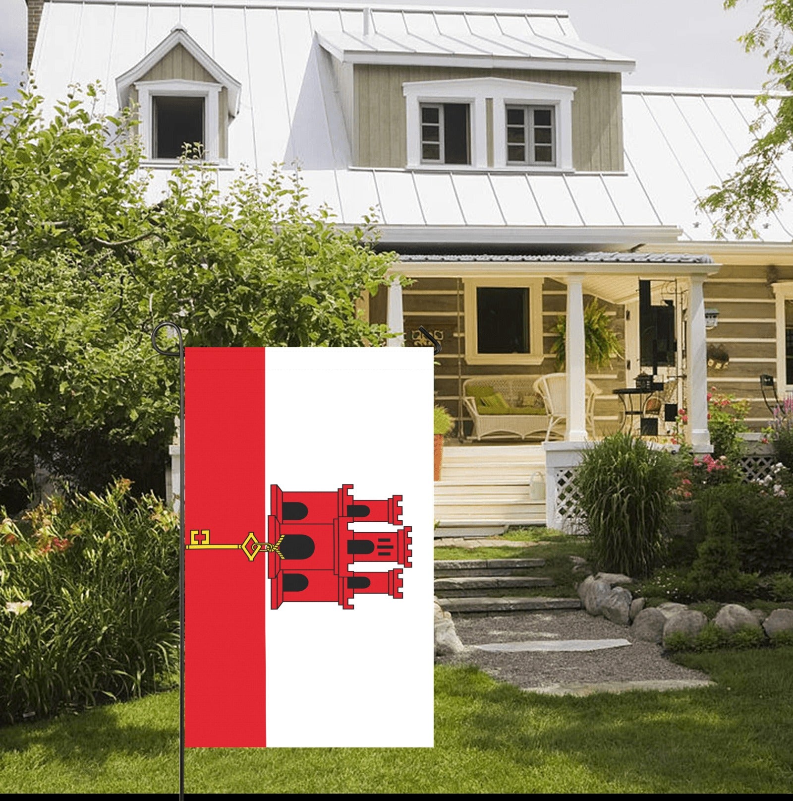 Luv My Flag Gibraltar flag displayed in front yard.