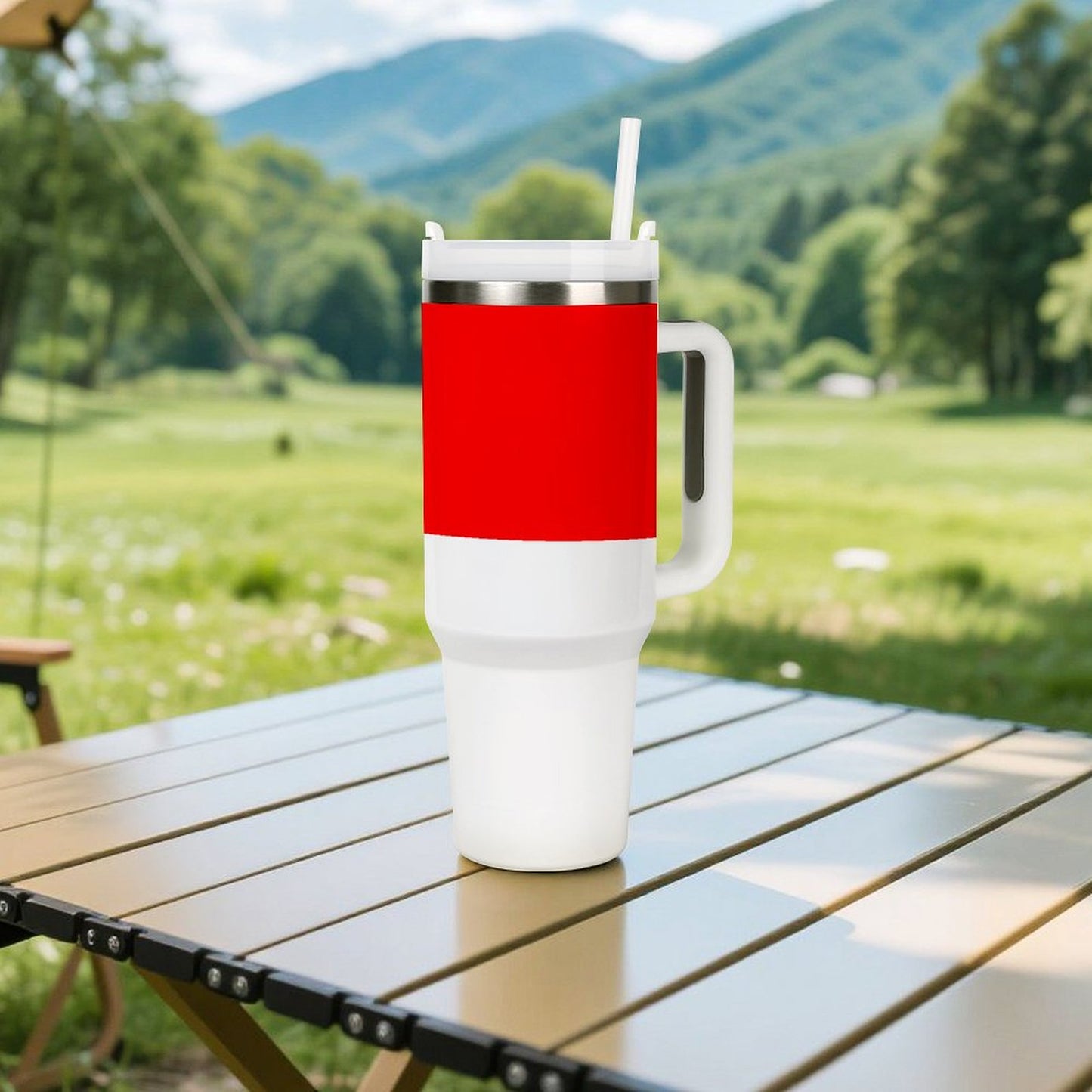 [Brand] red and white travel mug on outdoor table.