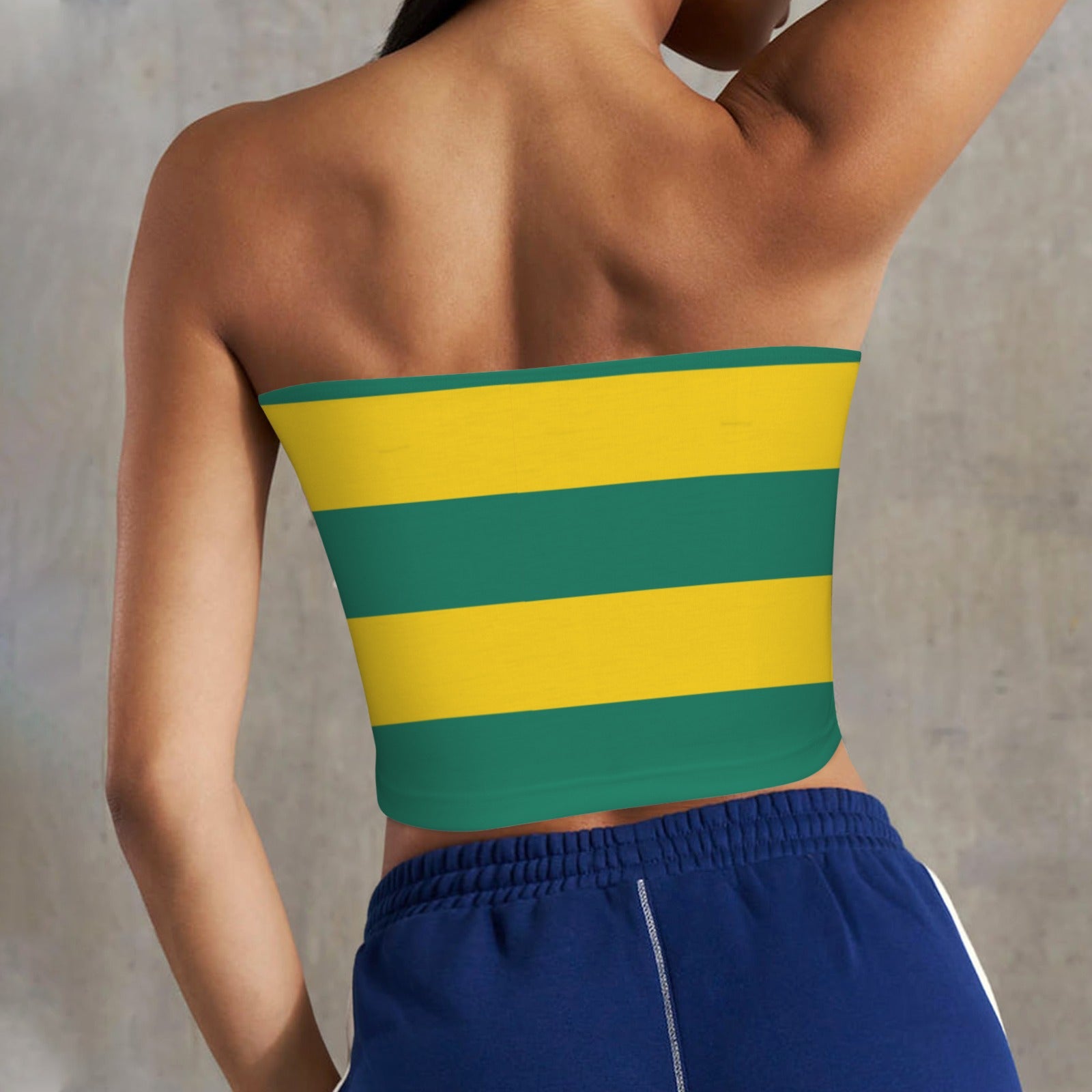Striped yellow-green [Brand] top with blue athletic shorts.