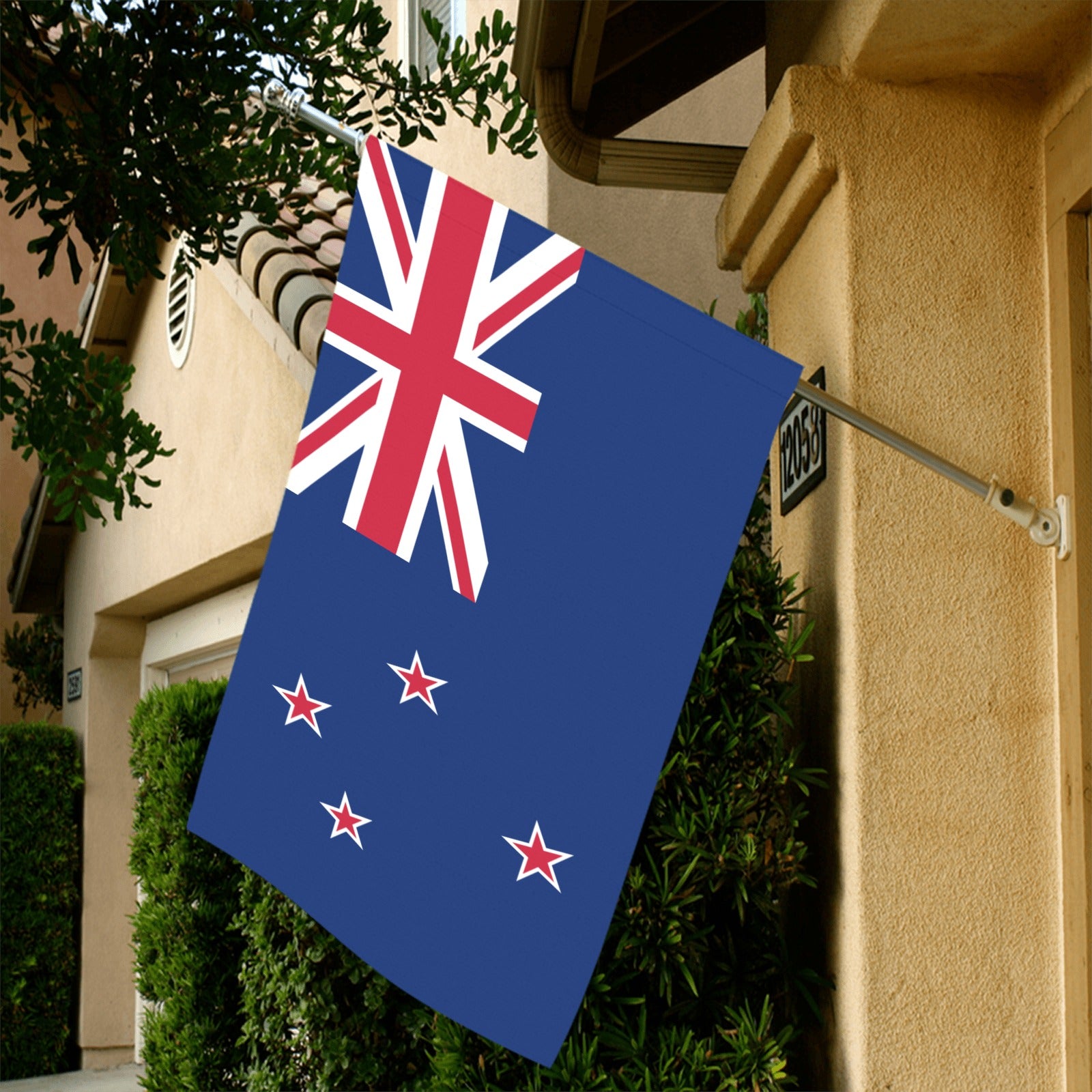 Luv My Flag showcasing New Zealand flag outside a home.