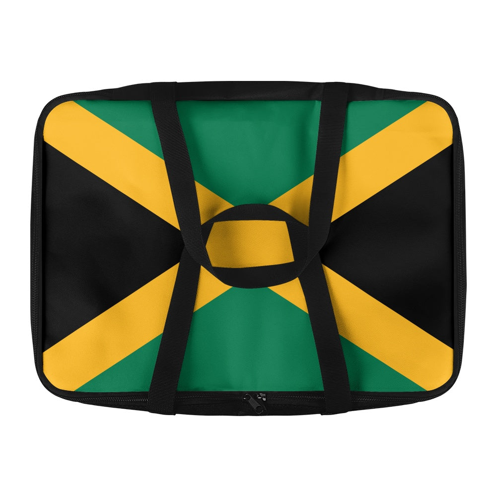 [Brand] bag with Jamaican flag design, black handles visible.