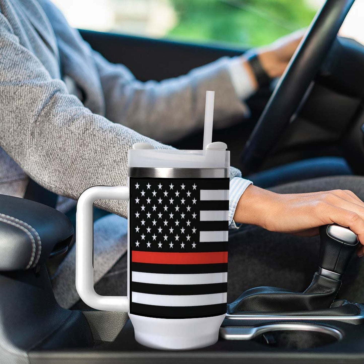 Driver with large [Brand] mug featuring American flag design.
