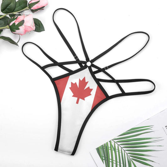 [Brand] strappy thong with Canadian flag design beside flowers.