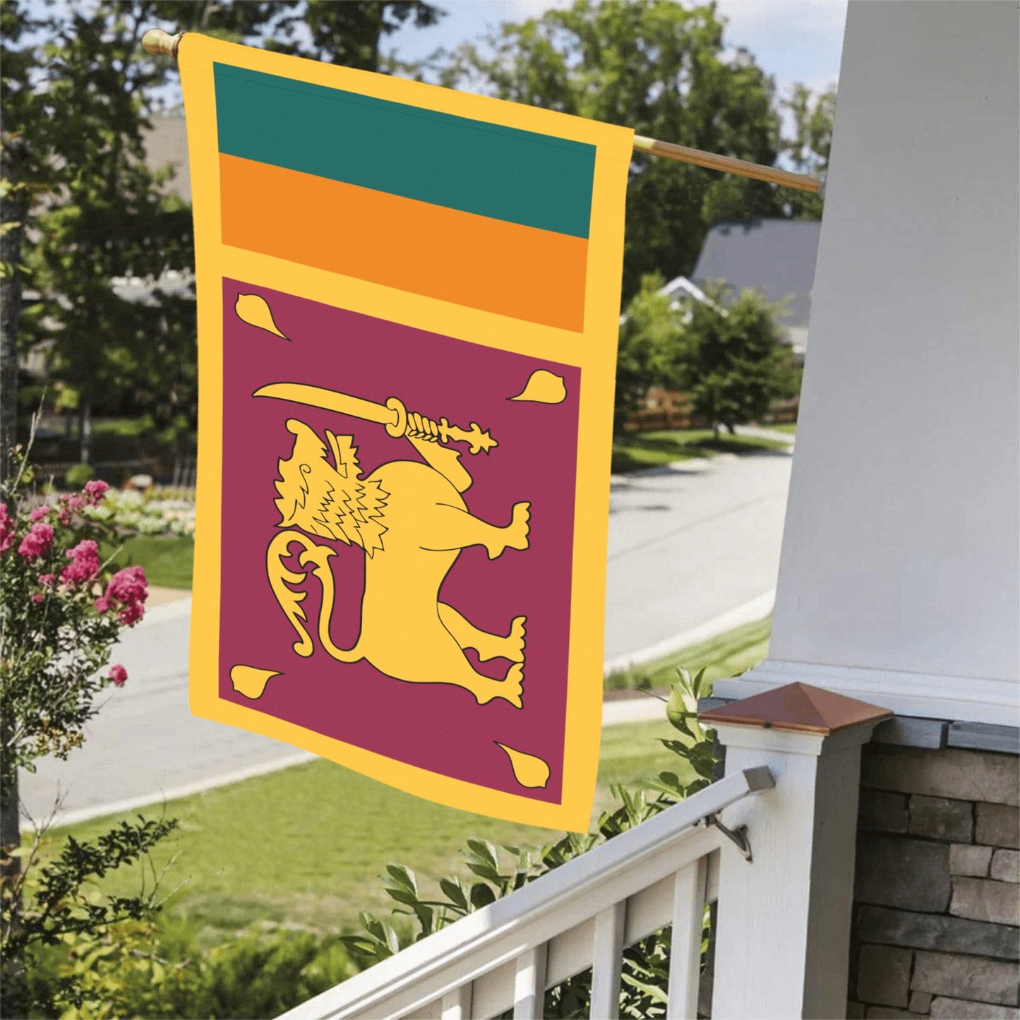 Luv My Flag displays colorful flag on porch railing.