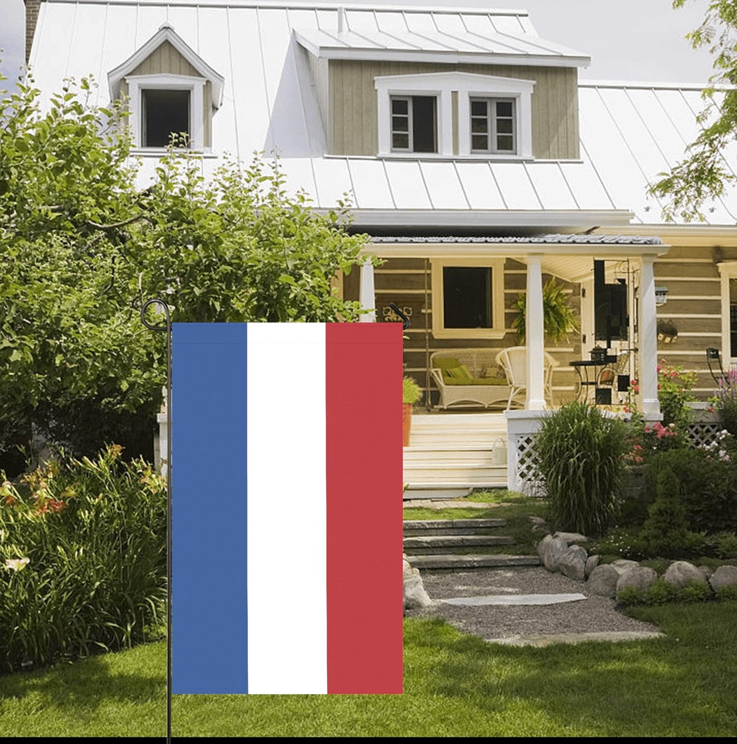 French flag by Luv My Flag outside charming country house.