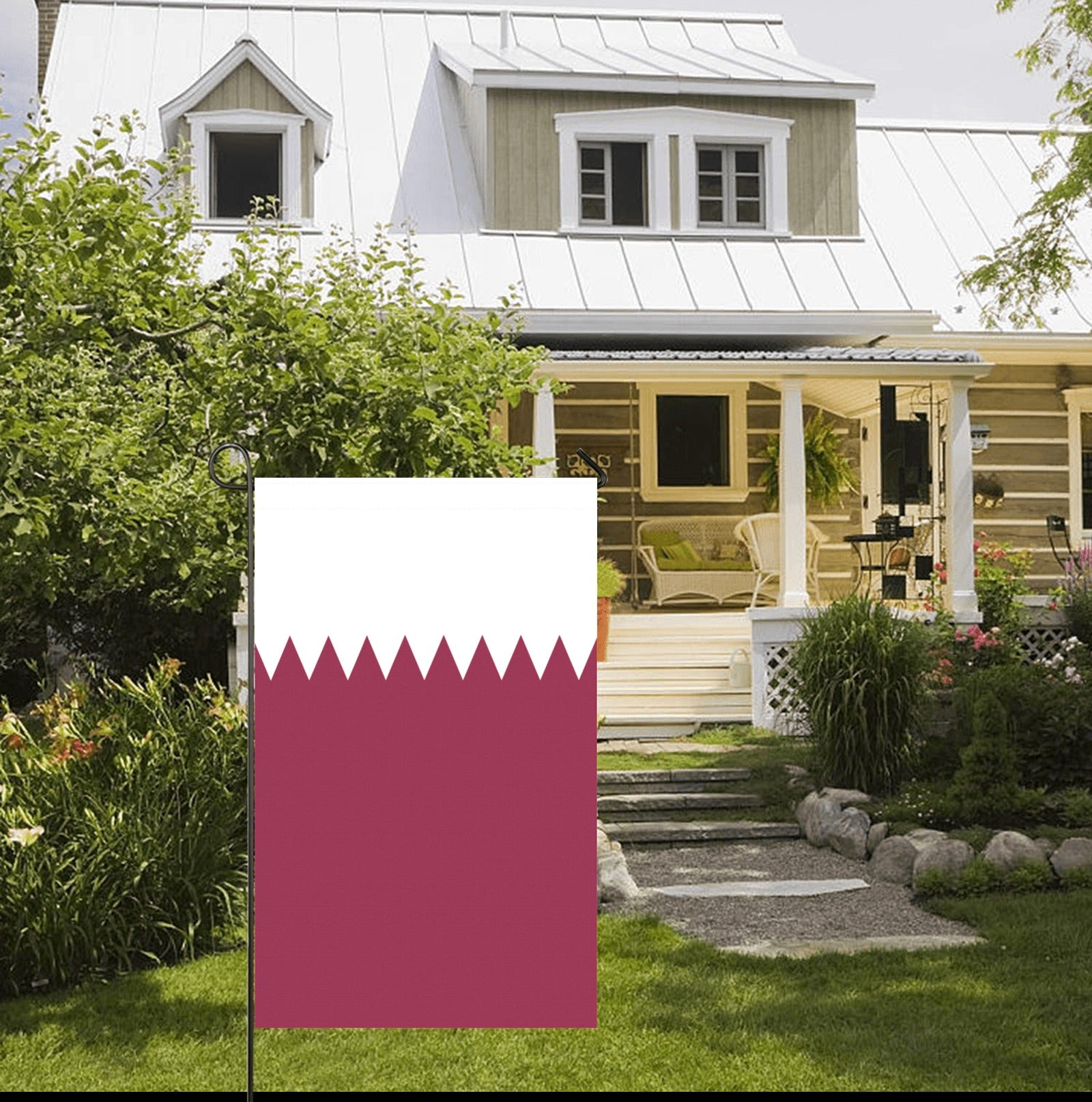 House with porch, garden, and Luv My Flag displayed outside.