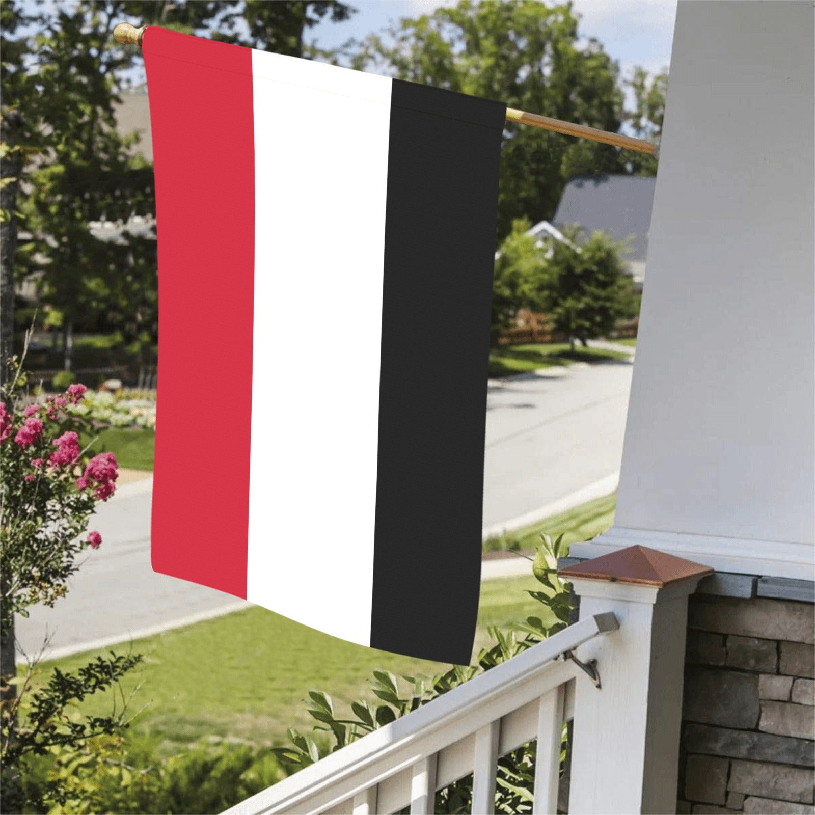 "Luv My Flag red, white, black vertical flag displayed outside."