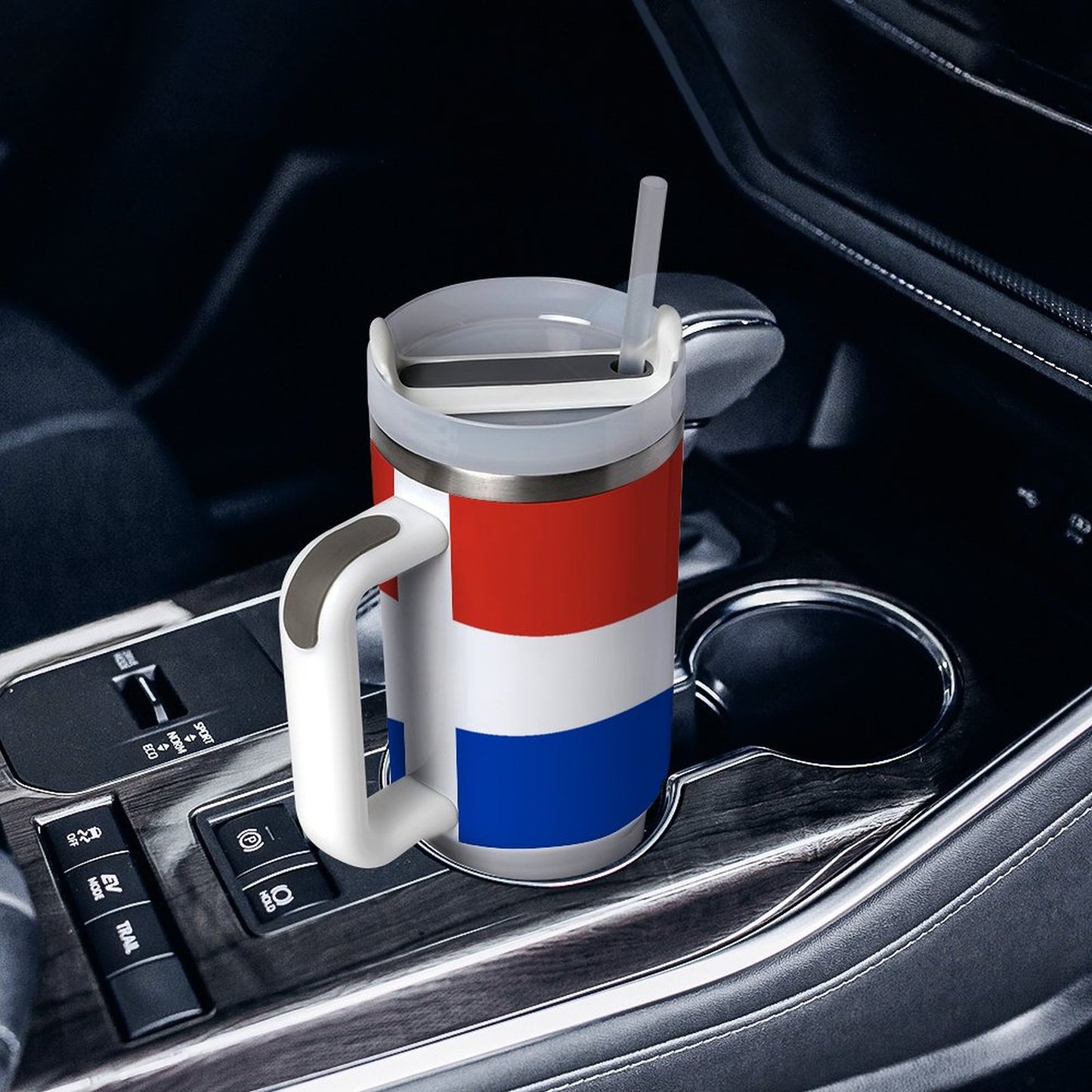 [Brand] mug with straw sits in car cup holder.