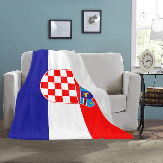 Luv My Flag Croatia blanket draped over beige couch.