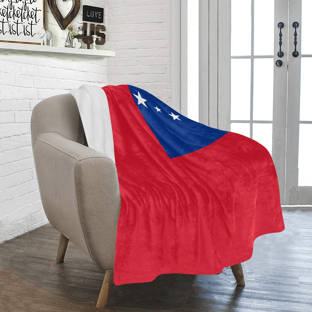 Cozy Luv My Flag blanket draped over comfy chair.